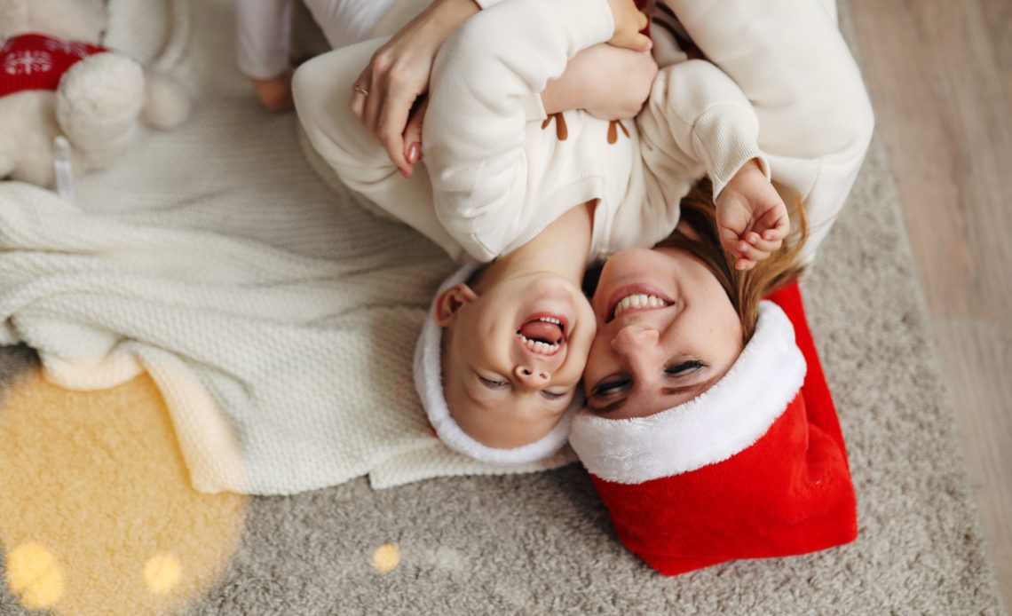 Happy mom and daughter celebrate Christmas